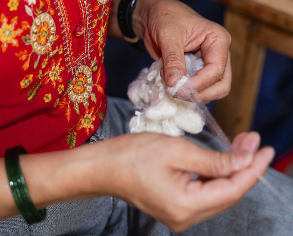 Raw Nepalese silk thread on a wooden spindle